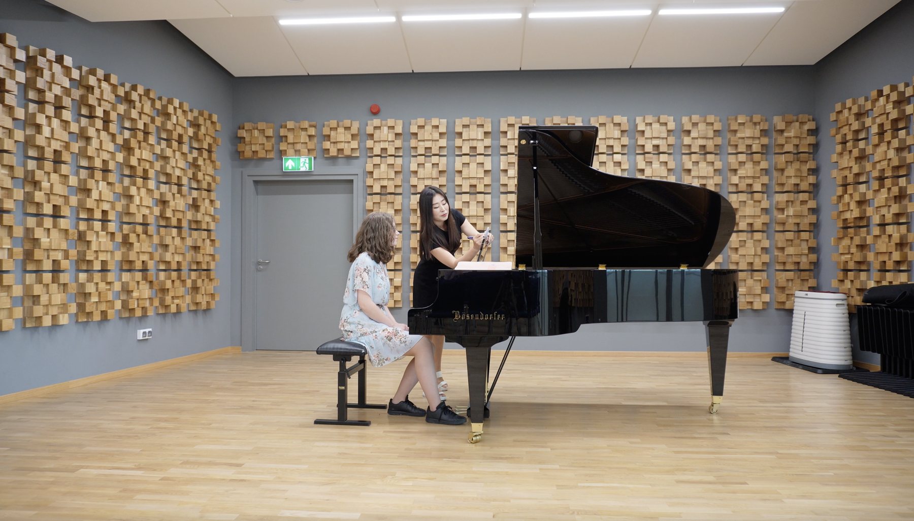 Dr. Lee guiding a piano student during a masterclass